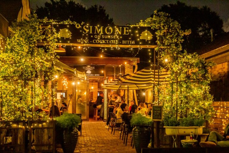 Simone on Sunset cocktail bar in Rice Village Houston entrance with patio lights