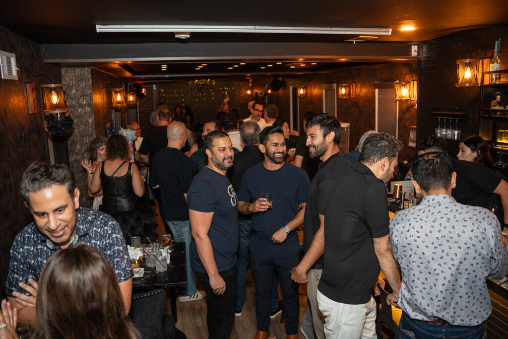 birthday dinner Houston celebration at Simone on Sunset with guests enjoying a lively group dining atmosphere