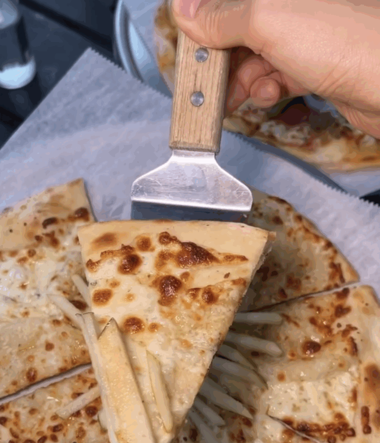 best pizza in Houston at Simone on Sunset with cheese pull and vegetables