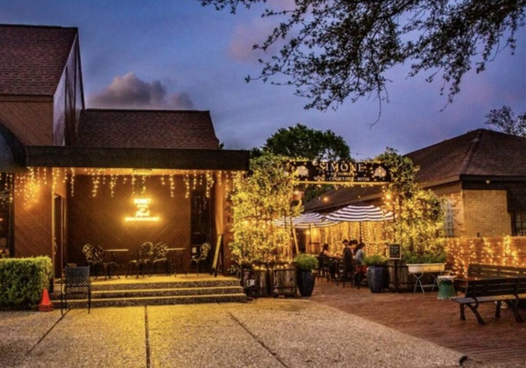 Simone on Sunset cocktail bar patio at night in Rice Village Houston