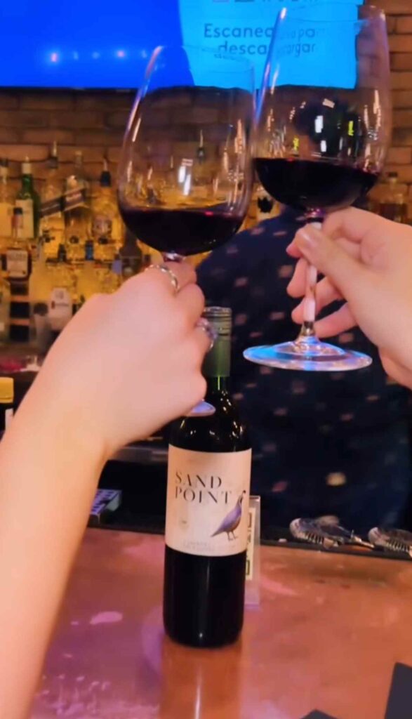 Wine bar Houston toast with red wine at Simone on Sunset