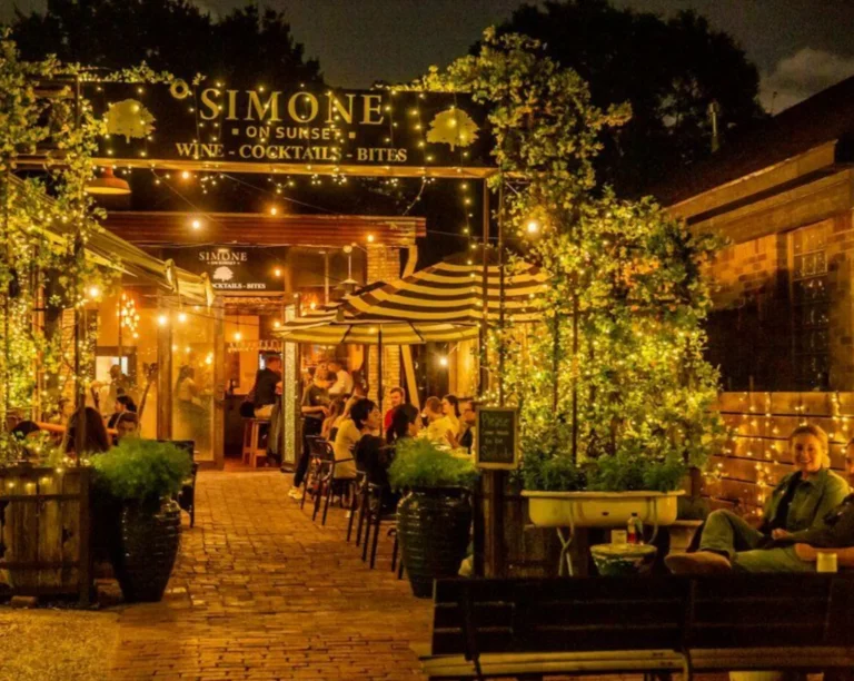 Wine cocktail lounge in Houston with guests enjoying an outdoor patio date night at Simone on Sunset