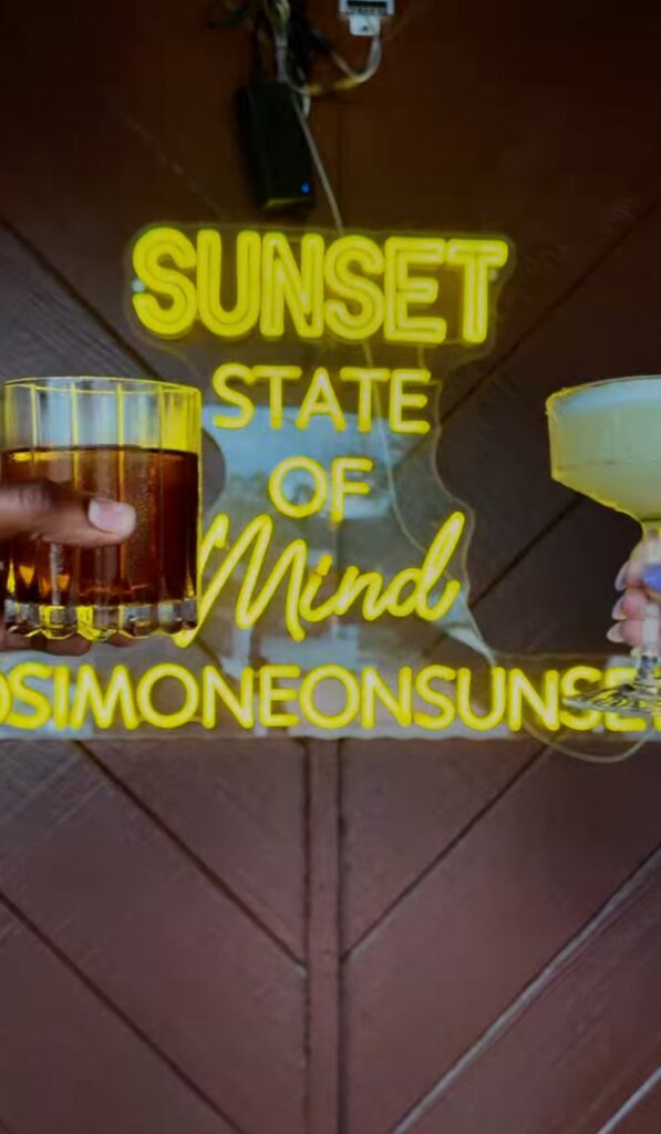 chill night Houston at Simone on Sunset neon sign cocktails